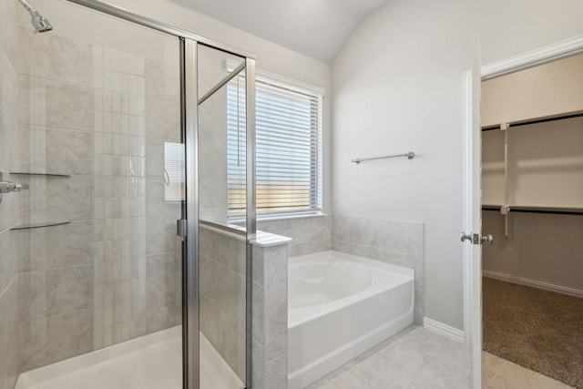 1817 Forest Wood, Mesquite, TX 75181 - full bathroom featuring a shower stall, a walk in closet, a garden tub, tile patterned flooring, and lofted ceiling