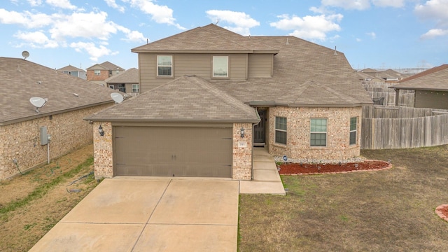 view of front facade featuring brick siding, fence, concrete driveway, roof with shingles, and a front yard