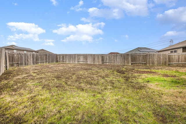 view of yard with a fenced backyard