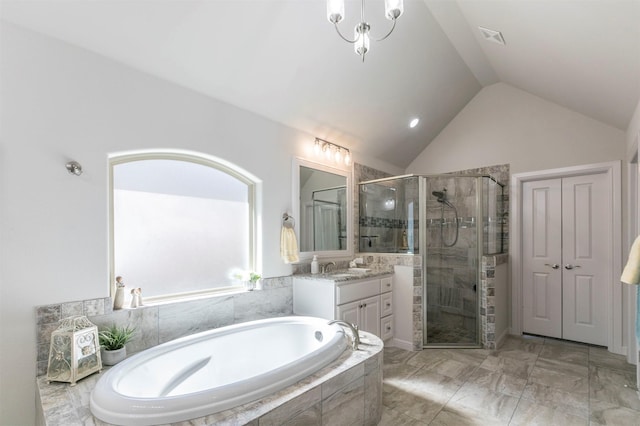 full bath with visible vents, a shower stall, a bath, vanity, and vaulted ceiling