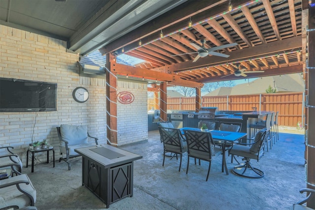 view of patio featuring ceiling fan, outdoor dining area, grilling area, and fence