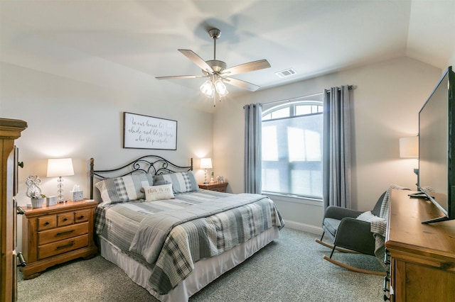 bedroom with a ceiling fan, baseboards, visible vents, lofted ceiling, and light carpet