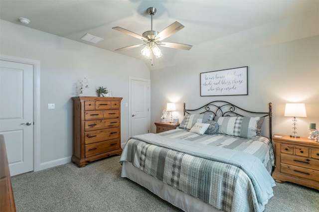 bedroom with light colored carpet, a ceiling fan, lofted ceiling, and baseboards