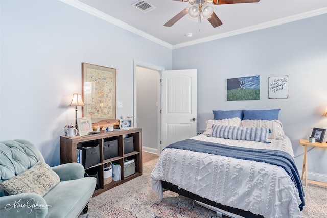 bedroom featuring visible vents, ceiling fan, baseboards, and ornamental molding