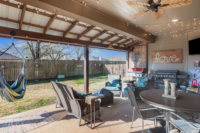 view of patio with a grill, an outdoor hangout area, and fence