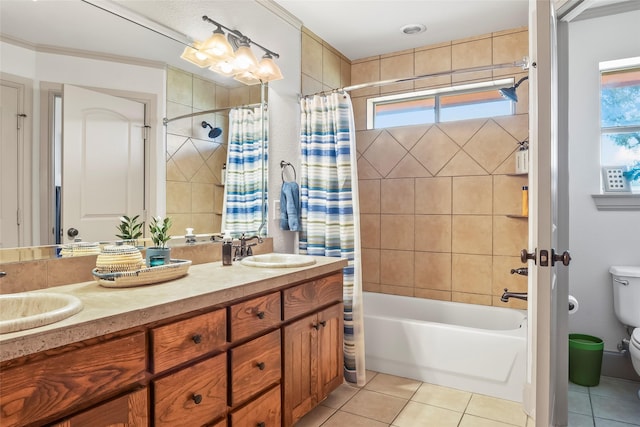 full bathroom featuring tile patterned flooring, toilet, shower / bath combo, and a sink