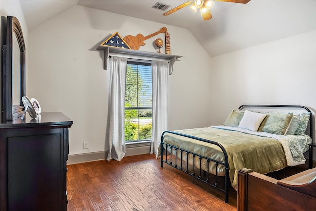 bedroom featuring visible vents, ceiling fan, baseboards, dark wood finished floors, and lofted ceiling