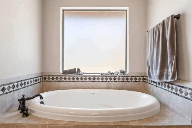 bathroom with a garden tub