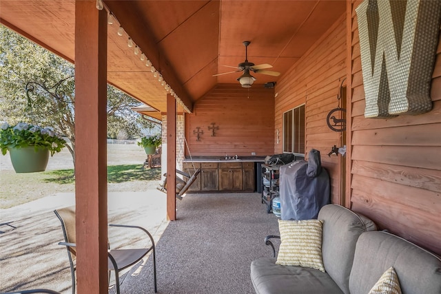 view of patio with a sink and ceiling fan