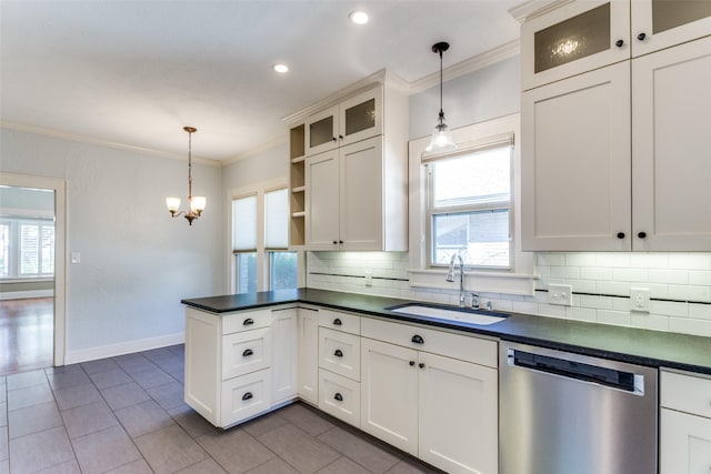 kitchen with ornamental molding, a sink, dishwasher, dark countertops, and tasteful backsplash