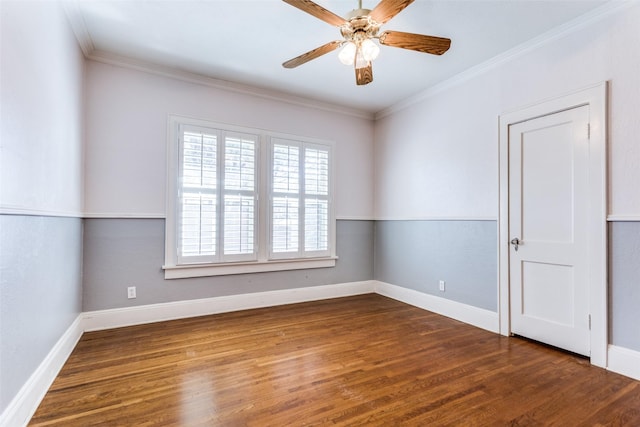 unfurnished room featuring baseboards, a ceiling fan, wood finished floors, and crown molding