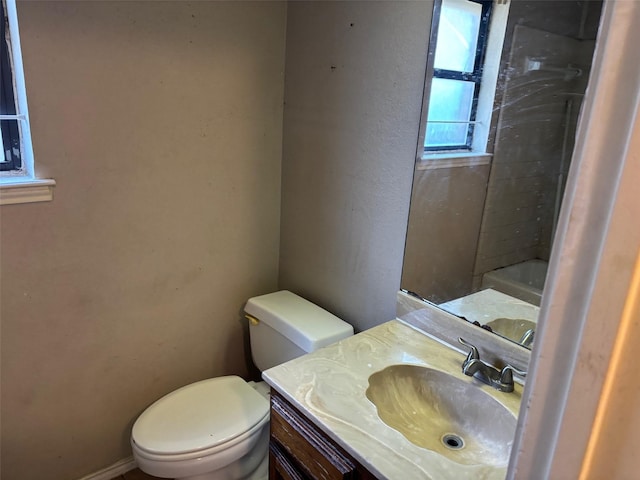 bathroom with a tub, a shower, toilet, and vanity