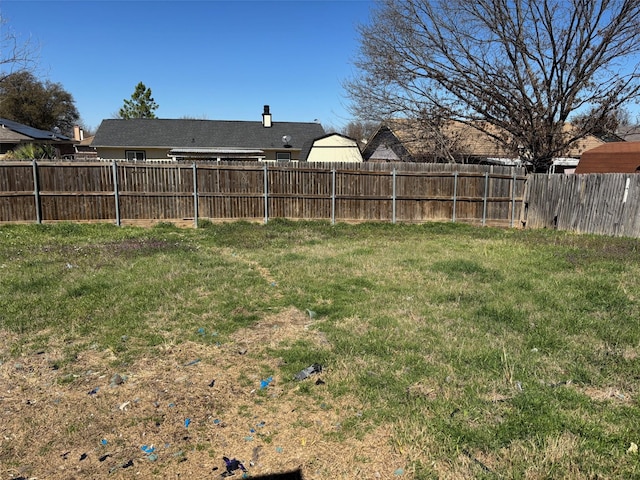 view of yard with a fenced backyard