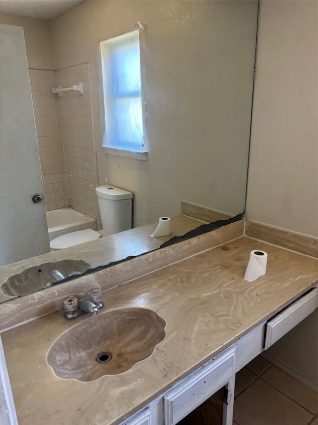 full bath with vanity, shower / bathing tub combination, toilet, and tile patterned flooring