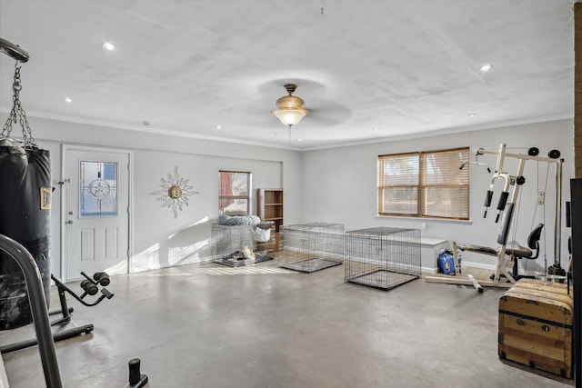 workout area featuring recessed lighting and ornamental molding