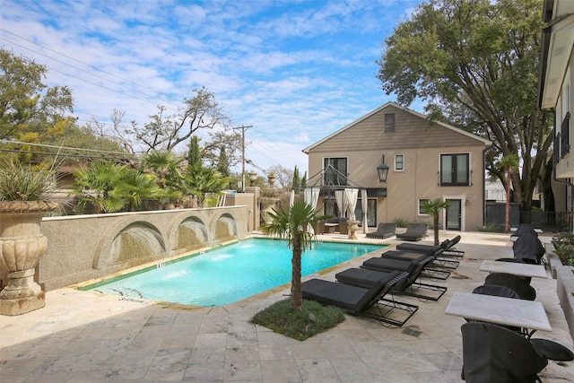 view of pool with a patio, a fenced backyard, and a fenced in pool