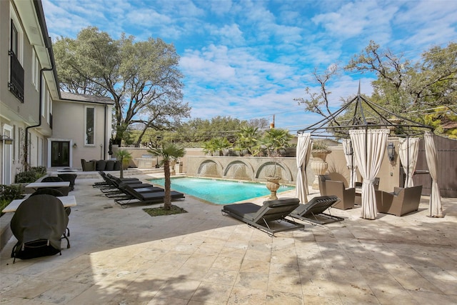 view of pool with a gazebo, a fenced in pool, a patio, and a fenced backyard