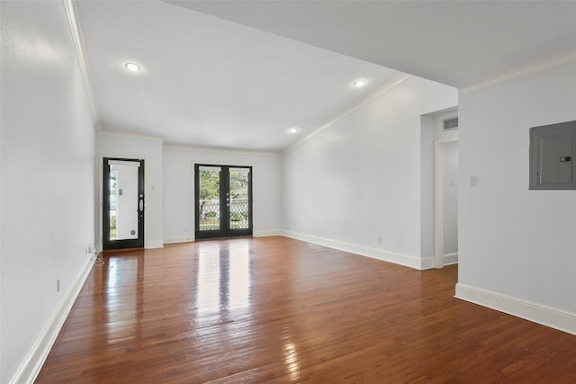 unfurnished room featuring hardwood / wood-style flooring, electric panel, french doors, and visible vents