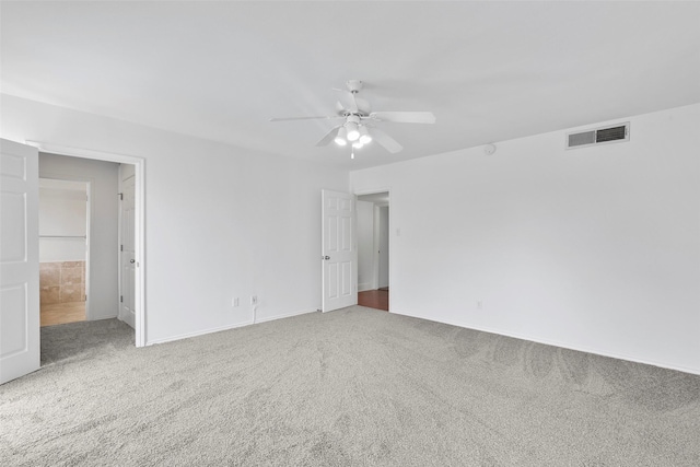 unfurnished bedroom featuring carpet flooring, visible vents, and ceiling fan