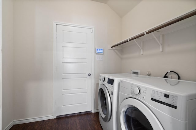 laundry room with washing machine and clothes dryer, laundry area, dark wood-type flooring, and baseboards