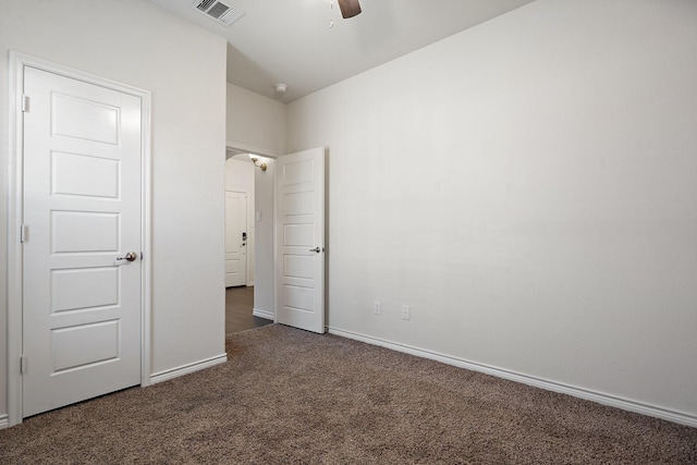 unfurnished bedroom featuring ceiling fan, carpet, visible vents, and baseboards