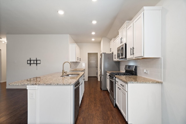 kitchen featuring a sink, appliances with stainless steel finishes, dark wood-style floors, and white cabinetry