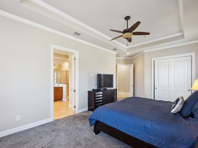 bedroom featuring visible vents, crown molding, baseboards, light carpet, and a raised ceiling