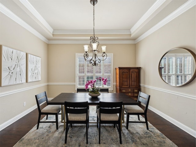 dining space featuring a wealth of natural light, baseboards, a chandelier, and dark wood-style flooring