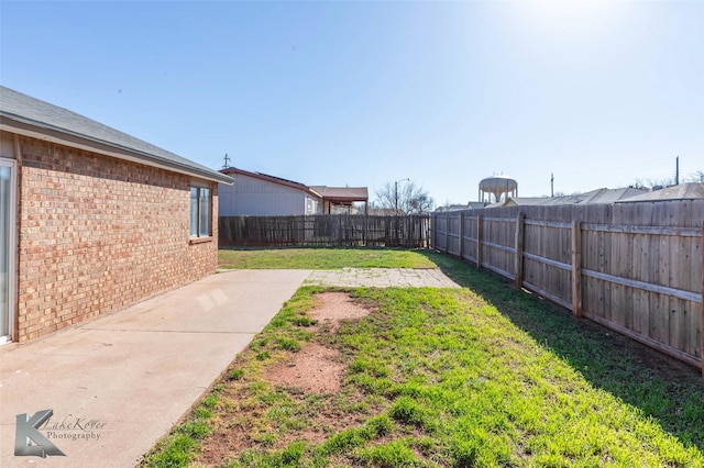 view of yard featuring a fenced backyard and a patio area