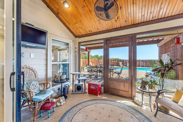 sunroom featuring lofted ceiling, a healthy amount of sunlight, and wooden ceiling