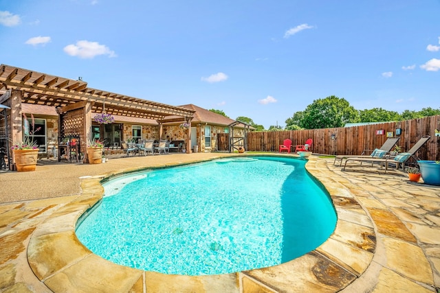 view of swimming pool featuring a patio area, a fenced in pool, a pergola, and fence