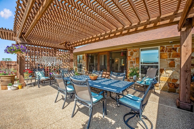 view of patio featuring outdoor dining area and a pergola