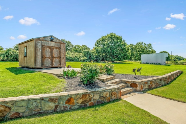 view of yard with an outbuilding and a storage shed