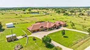 birds eye view of property featuring a rural view