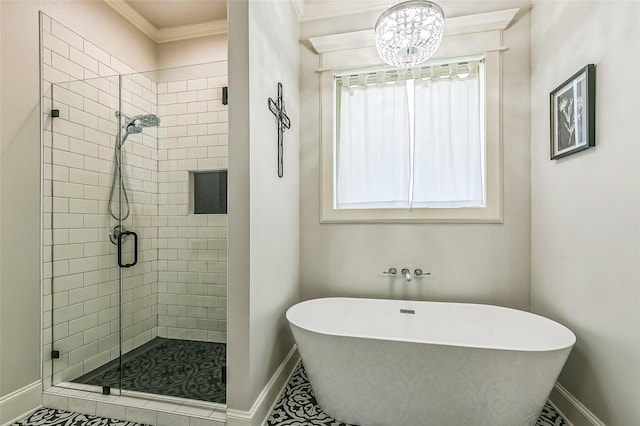 full bath featuring a shower stall, ornamental molding, baseboards, and a freestanding bath