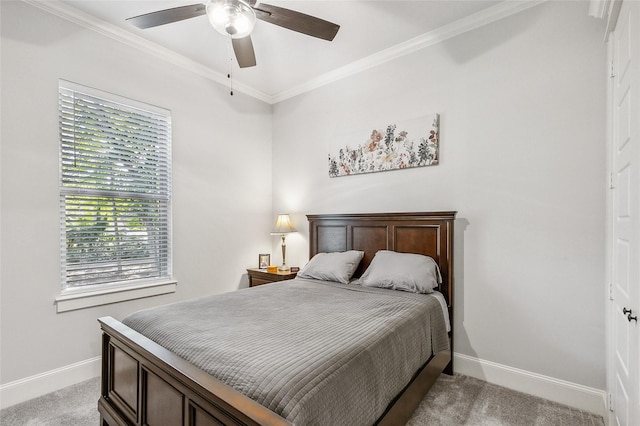 bedroom with crown molding, light colored carpet, and baseboards