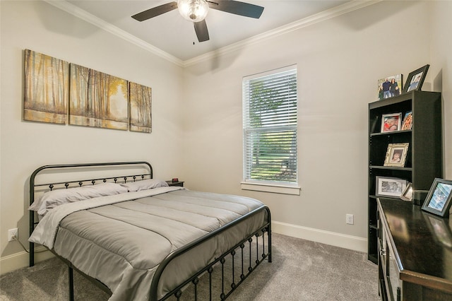 bedroom featuring ceiling fan, baseboards, crown molding, and carpet