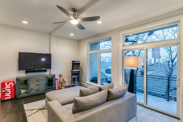 living area with recessed lighting, wood finished floors, and a ceiling fan