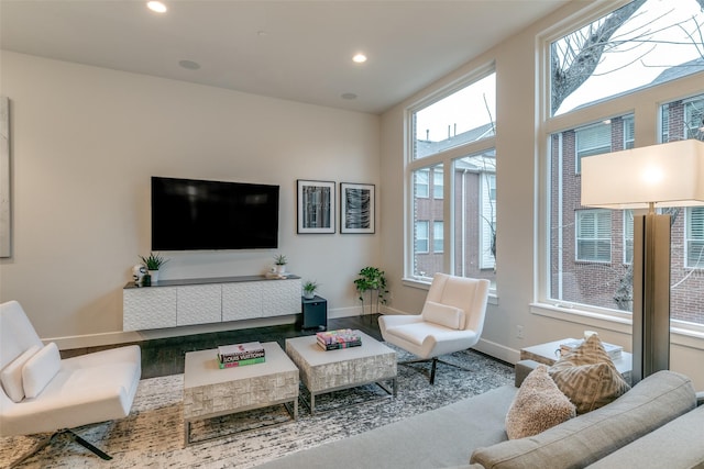 living room with recessed lighting and baseboards