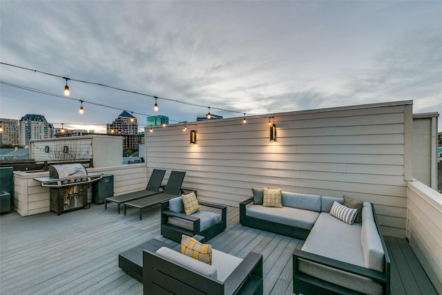 deck featuring an outdoor living space and a view of city