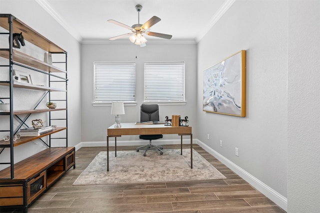 office space featuring crown molding, baseboards, and wood tiled floor