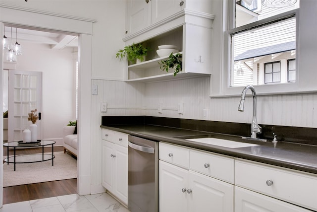 kitchen with white cabinetry, open shelves, a sink, dishwasher, and dark countertops