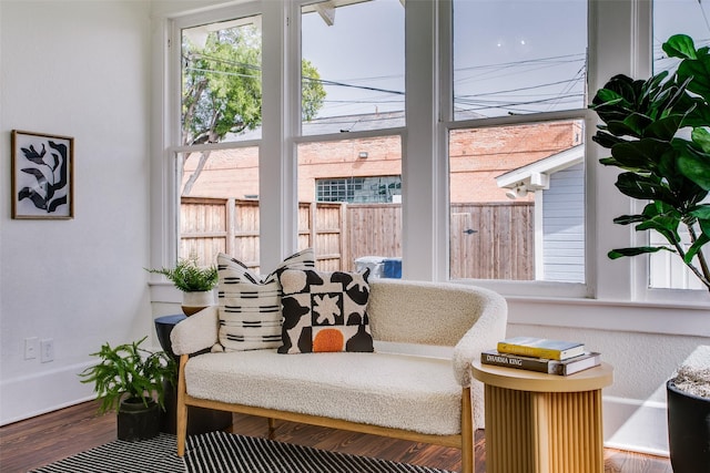 sitting room featuring wood finished floors