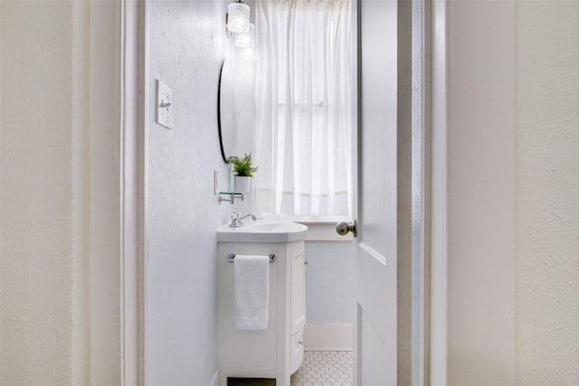 bathroom with vanity and tile patterned floors