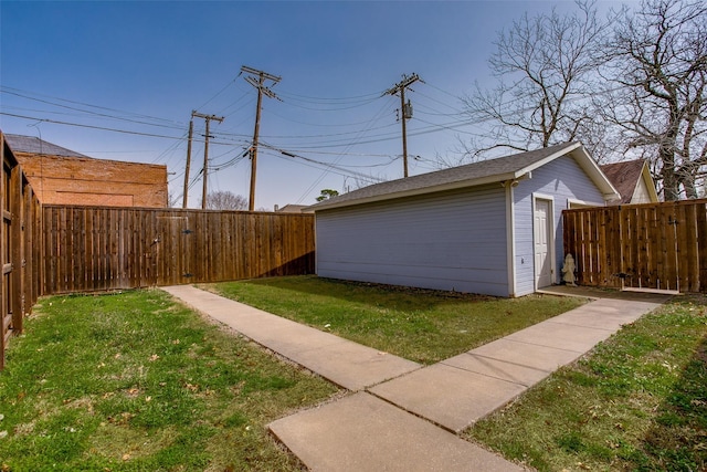 view of yard featuring an outbuilding and a fenced backyard