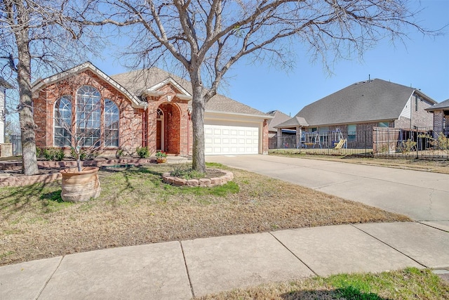 view of front of home with fence, concrete driveway, a garage, stone siding, and brick siding