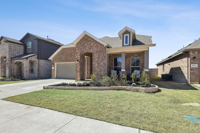 view of front of property featuring brick siding, an attached garage, concrete driveway, and a front yard