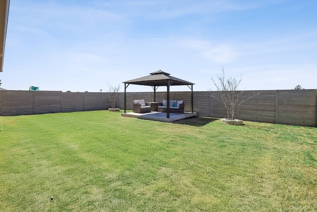 view of yard featuring a gazebo, a patio, and a fenced backyard