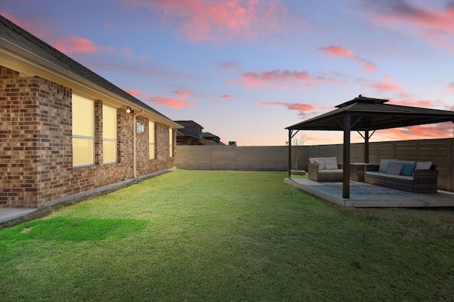 view of yard with a patio, a fenced backyard, and outdoor lounge area