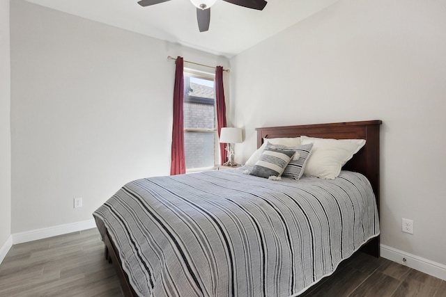 bedroom with baseboards, wood finished floors, and a ceiling fan